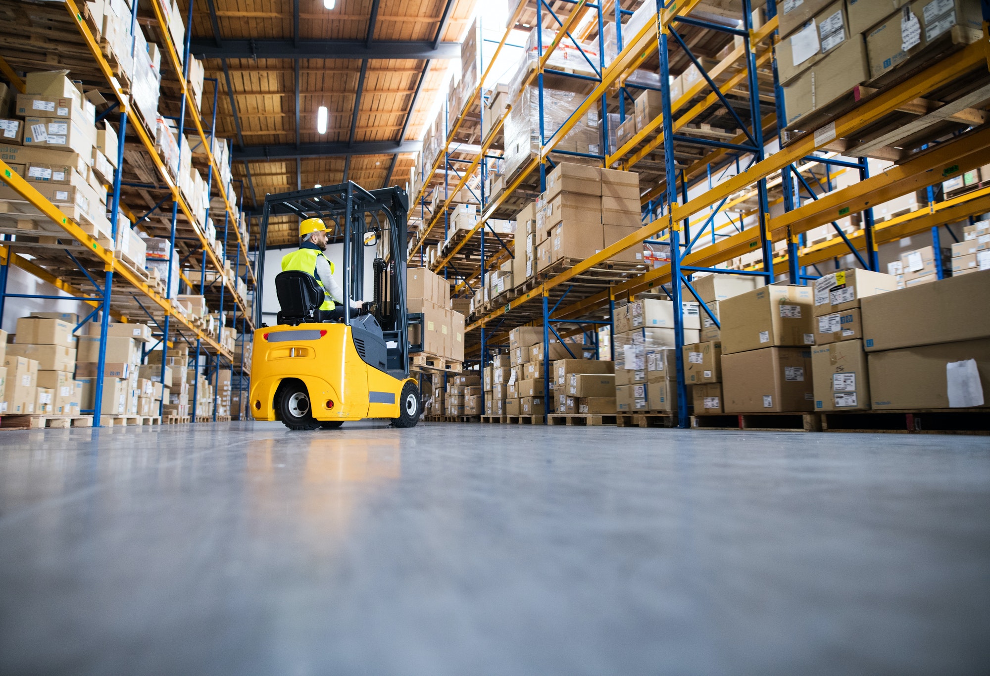 Warehouse man worker with forklift.